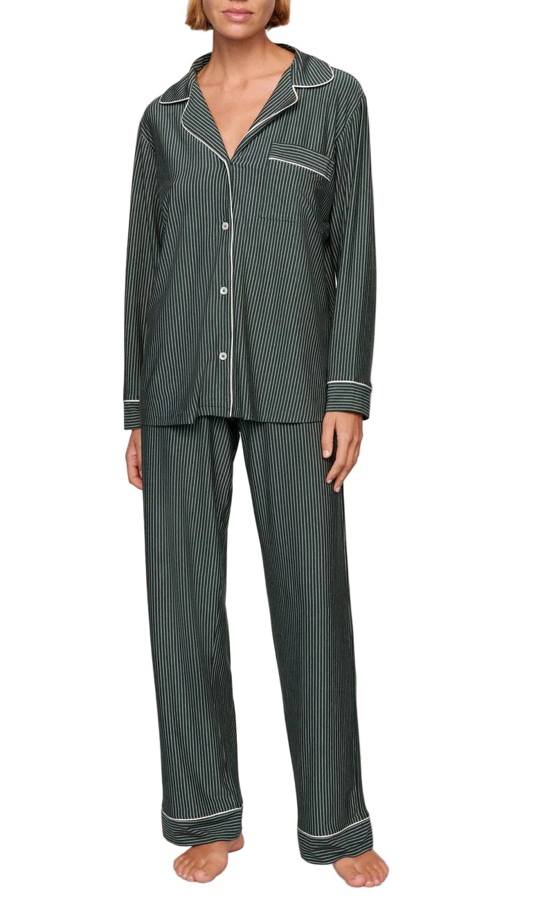 A person stands barefoot against a white background wearing the Eberjey Gisele Printed Stripe Long PJ Set—a relaxed, buttery soft sleepwear set with a button-up top and long pants.