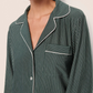 A person wearing the Eberjey Gisele Printed Stripe Long PJ Set in dark green with pinstripes, featuring white piping and a breast pocket, shown from shoulders to mid-chest.