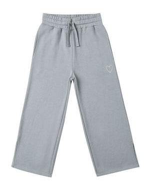 The Girls' Hailey Sweatpant by Rylee & Cru features a light gray wide-leg design with an elastic waistband, drawstring, side pockets, and a small white heart outline on the left thigh.
