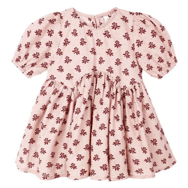 The Rylee & Cru Baby Girls' and Girls' Rose Dress features short sleeves, a gathered waist, and an all-over dark red floral print on light pink fabric.