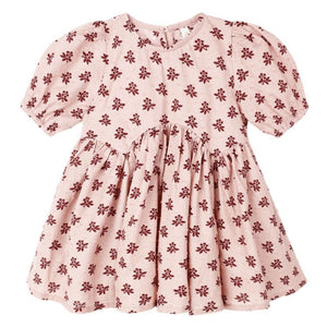 The Rylee & Cru Baby Girls' and Girls' Rose Dress features short sleeves, a gathered waist, and an all-over dark red floral print on light pink fabric.