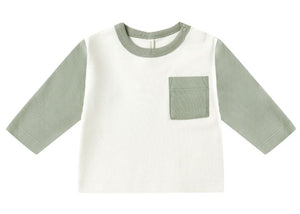 The Quincy Mae Baby Boys' Long Sleeve Raglan Tee features sage green sleeves, a white body, matching sage collar, and a left chest pocket in organic brushed cotton for a relaxed fit.