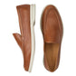 The Peter Millar Excursionist Leather Venetian Loafer is a brown, water-resistant leather loafer with white rubber soles, displayed from the side and top. The insole features the "Peter Millar" label.