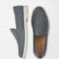 The Peter Millar Excursionist Nubuck Venetian Loafer, a blue lightweight shoe with white soles, is displayed from side and top view on a plain white background.