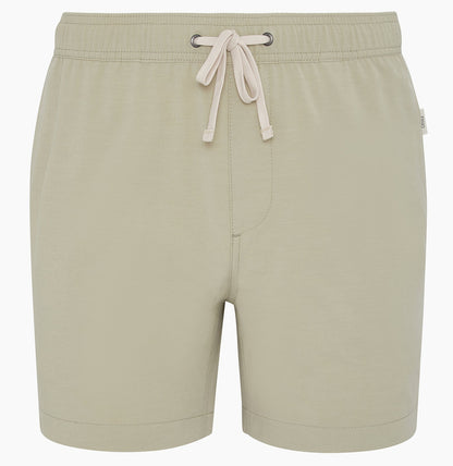 The Onia Land to Water Short 6" in light beige features an elastic waistband, front tie, straight hem, and four-way stretch for comfort. Shown on a plain white background.