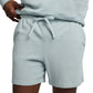 A person in Onia’s Slub Terry Short and matching hoodie, one hand on the waistband—an effortless lounge essential.