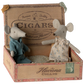 Maileg’s Mum & Dad Mice, dressed in nightwear and a dress, sit cozily inside their “Havana Cigars” branded cigarbox bed.