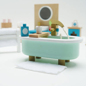 The Daisylane Bathroom furniture set is perfect for imaginative play in a dollhouse. It includes a bathtub, toilet, and sink.