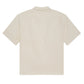 Back view of the Frame Jacquard Cotton Short-Sleeved Shirt in light beige with subtle vertical stripes—a breathable essential for your summer wardrobe.