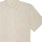 The Frame Jacquard Cotton Short-Sleeved Shirt features beige stripes, a chest pocket, and collar. Crafted from breathable cotton, it's perfect for summer and is shown against a white background.