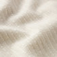 Close-up of the textured, cream jacquard cotton fabric used in Frame’s Jacquard Cotton Short-Sleeved Shirt—an airy, stylish choice for your summer wardrobe.