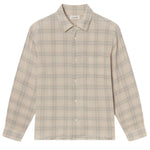 The Frame Plaid Shirt is a lightweight, long-sleeve button-up featuring a beige and blue plaid pattern in neutral tones, with a collar and chest pocket.