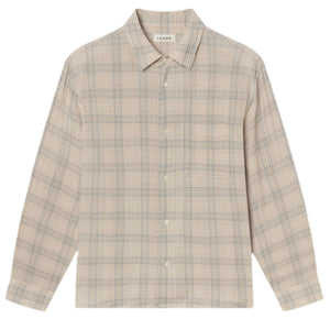The Frame Plaid Shirt is a lightweight, long-sleeve button-up featuring a beige and blue plaid pattern in neutral tones, with a collar and chest pocket.
