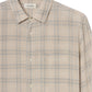 The Frame Plaid Shirt is a beige cotton-wool button-up with a collar and chest pocket, featuring light blue and white lines—an ideal everyday piece displayed against a plain background.