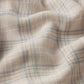 A close-up of Frame's Plaid Shirt shows its soft cotton-wool blend in blue and white with gentle folds, highlighting the comfortable texture—ideal for everyday wear.