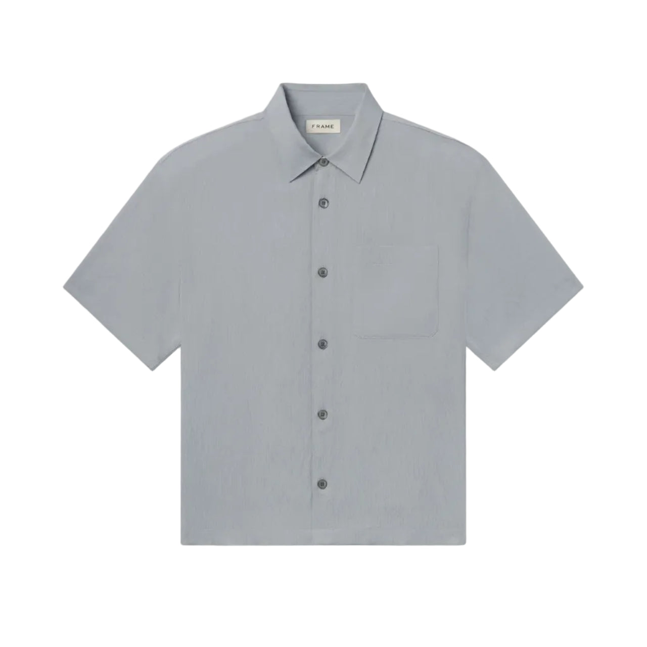 The Frame Lightweight Shirt is a light gray, short-sleeve button-up featuring a collar and a single chest pocket. Crafted from 100% cotton for a relaxed fit, this shirt is showcased lying flat against a white background.
