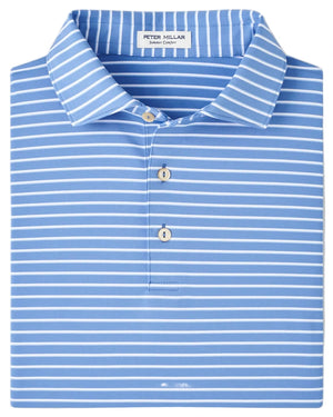 A folded Peter Millar Dunnes Performance Jersey Polo in blue and white stripes with a three-button placket and UPF 50+ protection, neatly arranged.