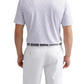 Man wearing a Peter Millar Orange Crush Performance Jersey Polo, light patterned and short-sleeve, tucked into white shorts with a gray belt, viewed from the back. Polo features UPF 50+ protection for all-day comfort.