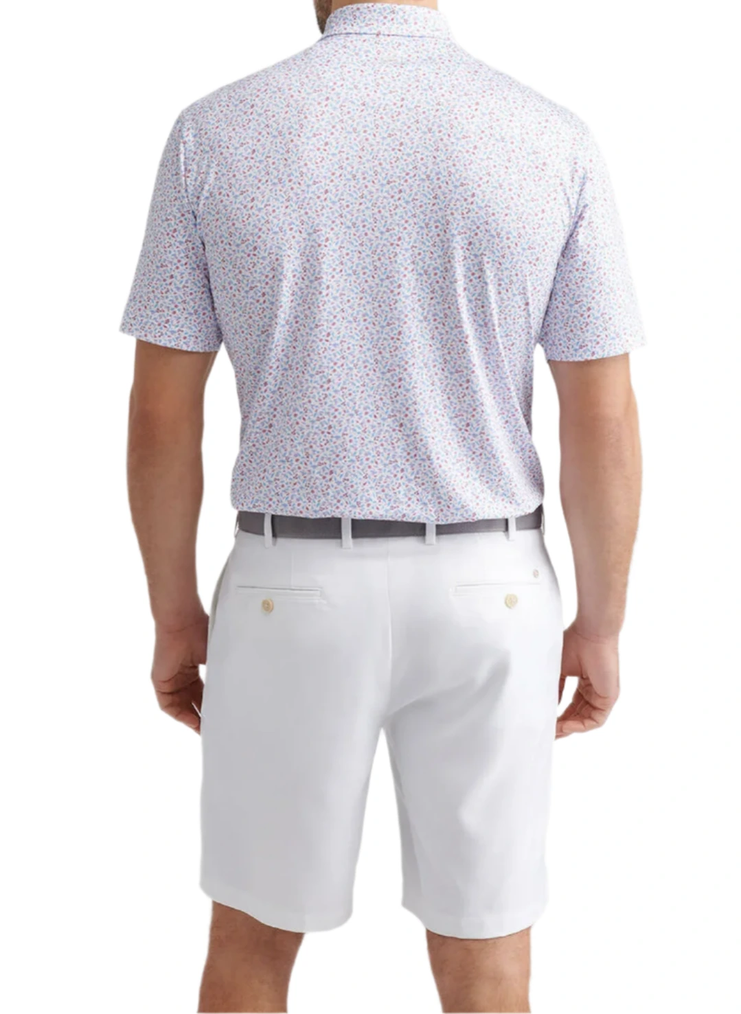 Man wearing a Peter Millar Orange Crush Performance Jersey Polo, light patterned and short-sleeve, tucked into white shorts with a gray belt, viewed from the back. Polo features UPF 50+ protection for all-day comfort.