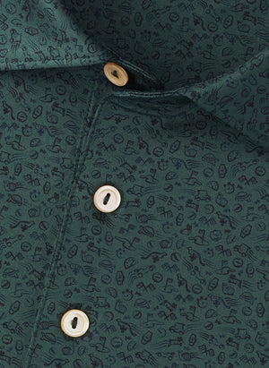 Close-up of a green Peter Millar No Slow Play Performance Jersey Polo featuring a subtle dark abstract pattern, four beige buttons on the placket, and four-way stretch for enhanced comfort.