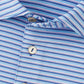 Close-up of the Peter Millar Lenway Performance Jersey Polo, featuring blue, white, and light purple horizontal stripes, three white buttons, and four-way stretch fabric for all-day comfort.