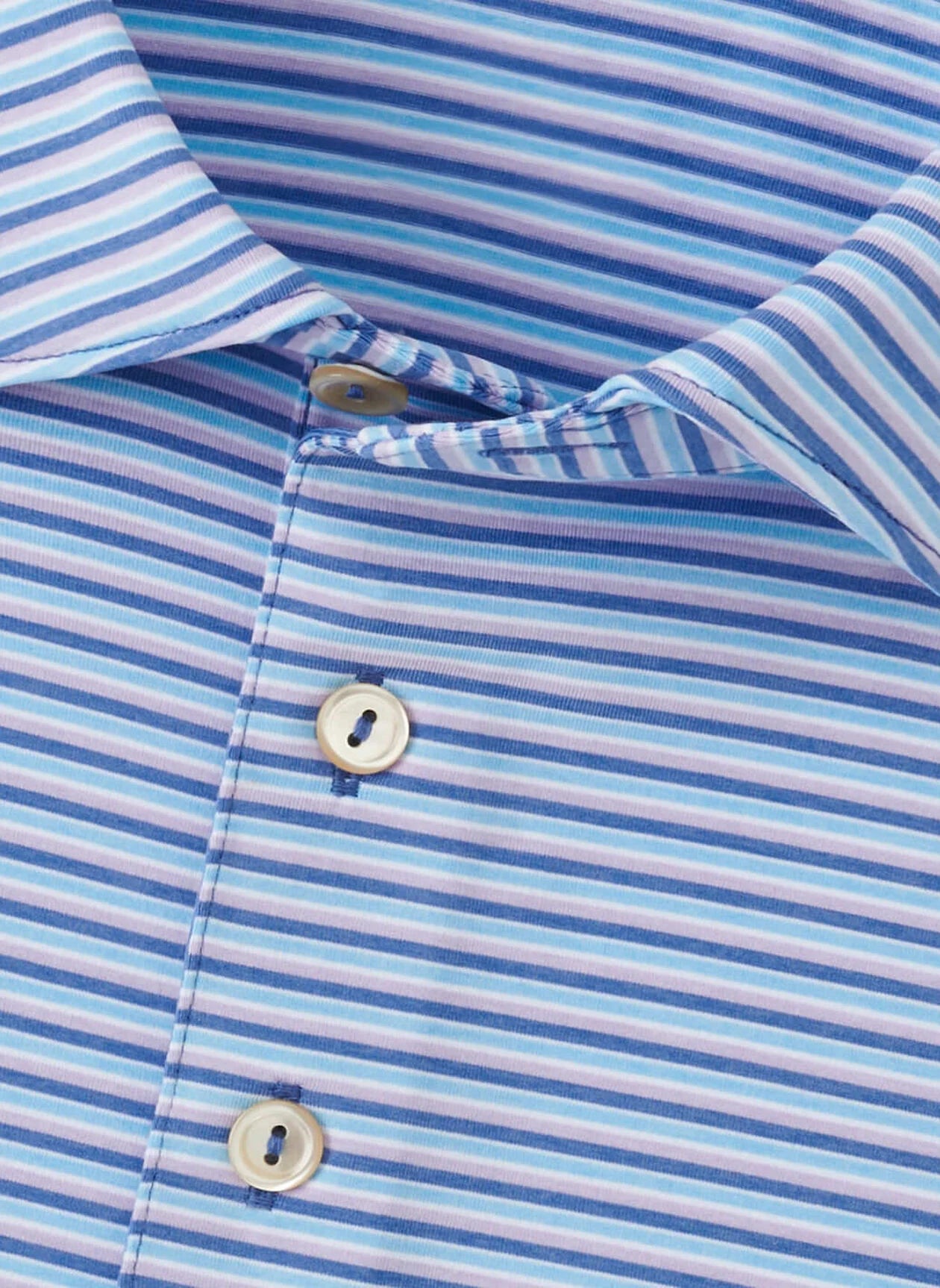 Close-up of the Peter Millar Lenway Performance Jersey Polo, featuring blue, white, and light purple horizontal stripes, three white buttons, and four-way stretch fabric for all-day comfort.