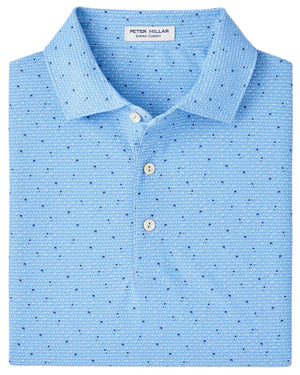 A folded light blue Peter Millar Old Fashioned Performance Mesh Polo with a subtle geometric pattern and three white buttons.