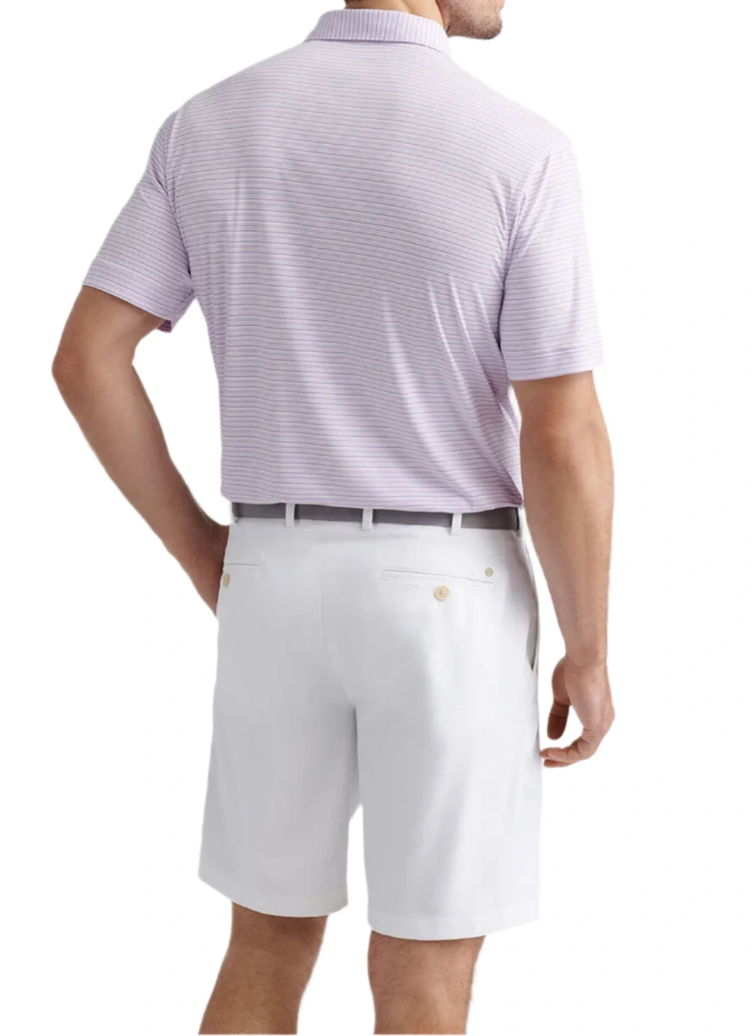 A man stands facing away, wearing the Peter Millar Featherweight Payne Stripe Performance Polo in light purple, paired with white shorts featuring belt loops and a grey belt.