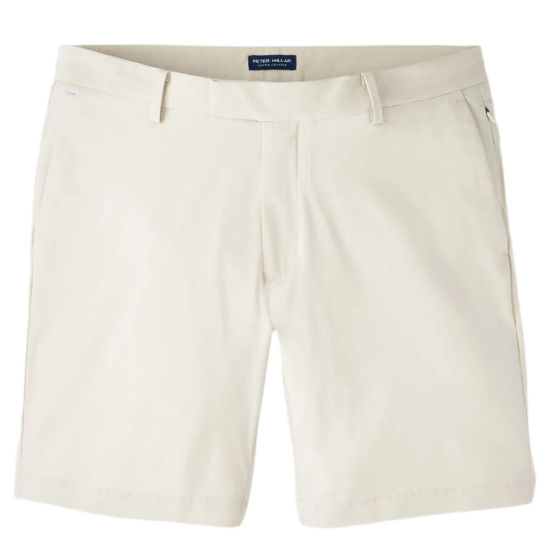 The Bingham Performance Short by Peter Millar is a beige, lightweight casual short with belt loops, side pockets, and a button closure, shown against a white background.