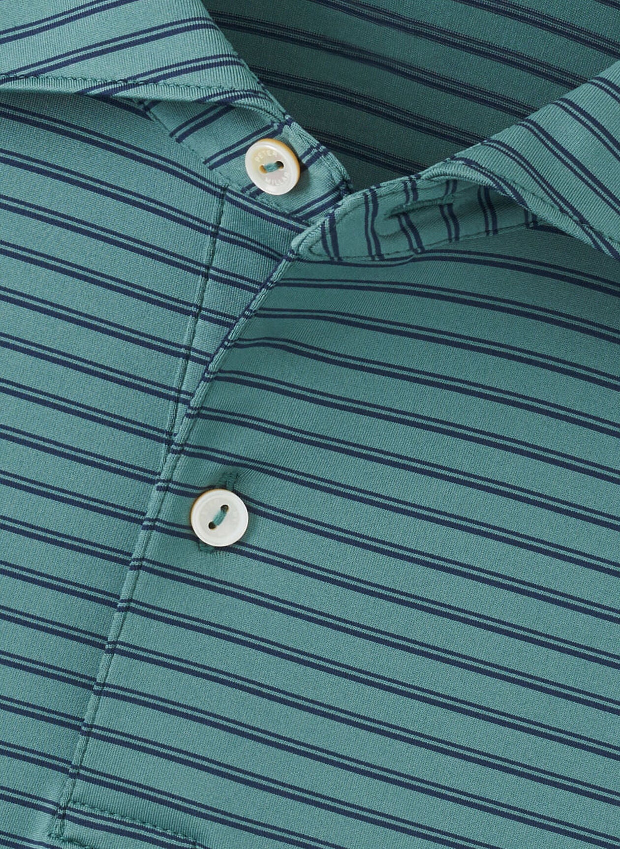 A close-up of the Bridge Performance Jersey Polo by Peter Millar, expertly crafted from four-way stretch fabric for superior comfort and flexibility.
