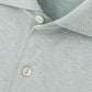 Close-up of the Peter Millar Albatross Cotton-Blend Pique Polo in light gray, featuring the collar, placket, and two white buttons.