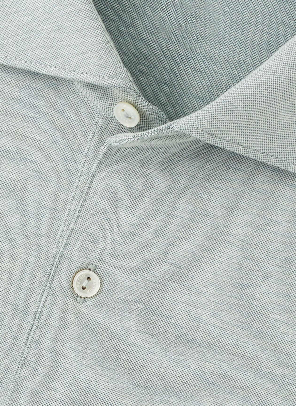 Close-up of the Peter Millar Albatross Cotton-Blend Pique Polo in light gray, featuring the collar, placket, and two white buttons.