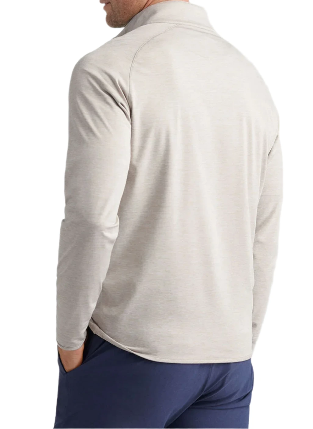 A man shown from the back with hands in his pockets wears the Peter Millar Stealth Performance Quarter-Zip, a lightweight pullover featuring UPF 50+ sun protection, paired with dark blue pants.