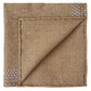 The Wells Pocket Square by Peter Millar features elegant brown Italian wool, folded to highlight its subtle herringbone pattern and small geometric corner designs.