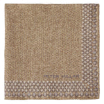 The Wells Pocket Square by Peter Millar features a tan and taupe Italian wool design, accented with a geometric border, a subtle herringbone pattern, and the Peter Millar signature logo.