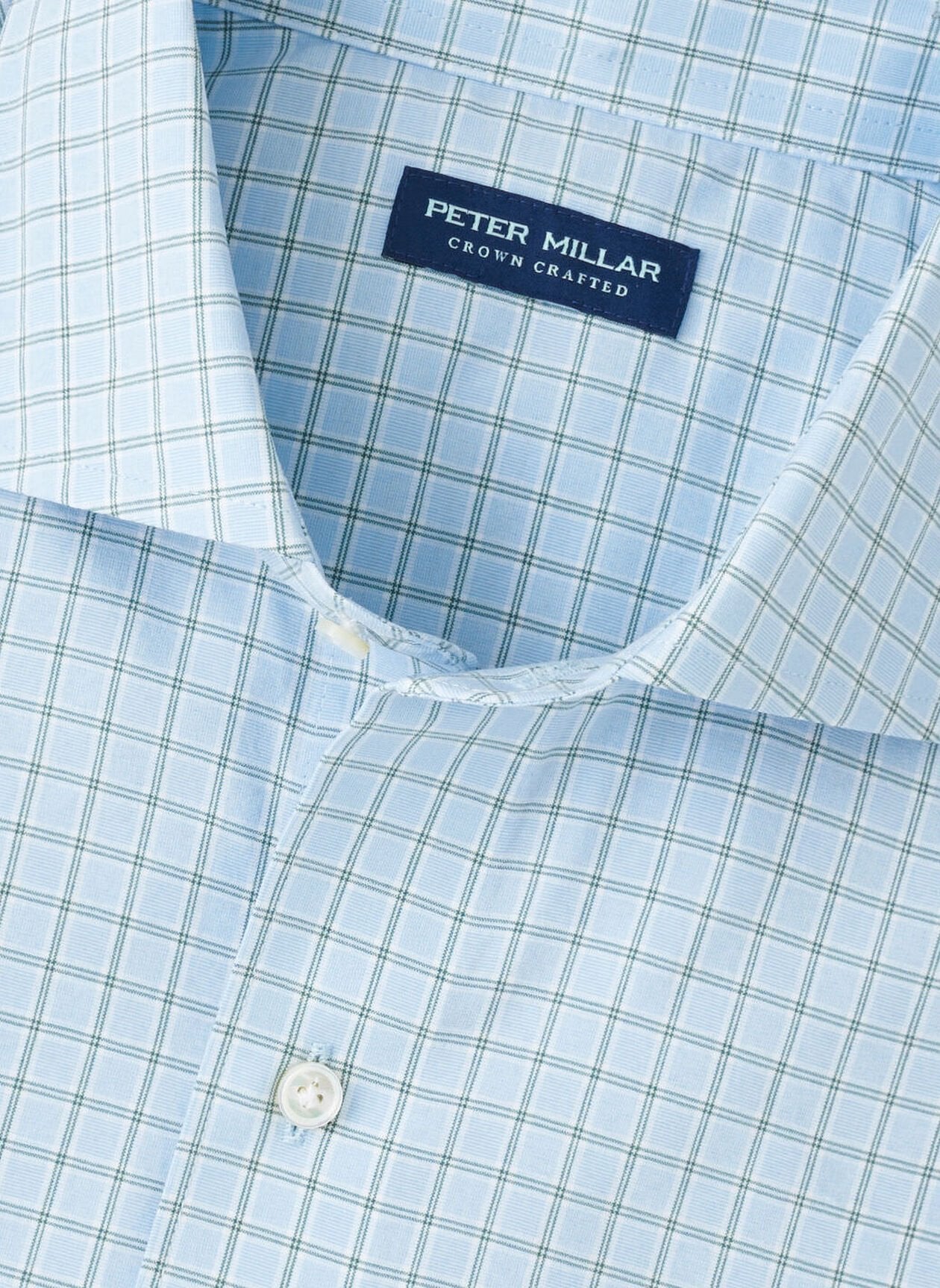 The Bechet Performance Poplin Sport Shirt by Peter Millar features a light blue and white checkered pattern and is made from performance fabric for comfort and style.