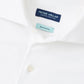 Close-up of the Peter Millar Excursionist Flex Solid Sport Shirt, showing labels inside the collar and crafted from wrinkle-resistant cotton-stretch fabric.