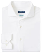 The Excursionist Flex Solid Sport Shirt by Peter Millar is a white, wrinkle-resistant cotton-stretch sport shirt with a pointed collar and buttoned cuffs.