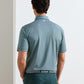 Back view of a person wearing a teal, fine-striped Jubilee Performance Jersey Polo with a small logo on the back of the neck, tucked into dark green trousers.