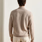 A man seen from the back wearing a lightweight, ribbed-knit, full-zip Pacific Full Zip Sweater by Peter Millar.
