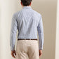 Back view of a person wearing a blue and white checkered Clarence Performance Poplin Sport Shirt tucked into beige pants with a brown belt.