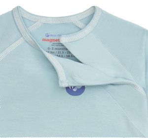 The Baby Boys' Captain Wally Magnetic Top & Pant Set by Magnetic Me features eco-friendly modal fabric, magnetic closure near the neckline for easy changes, and an inside collar label with 0-3 months size and sustainable material info.