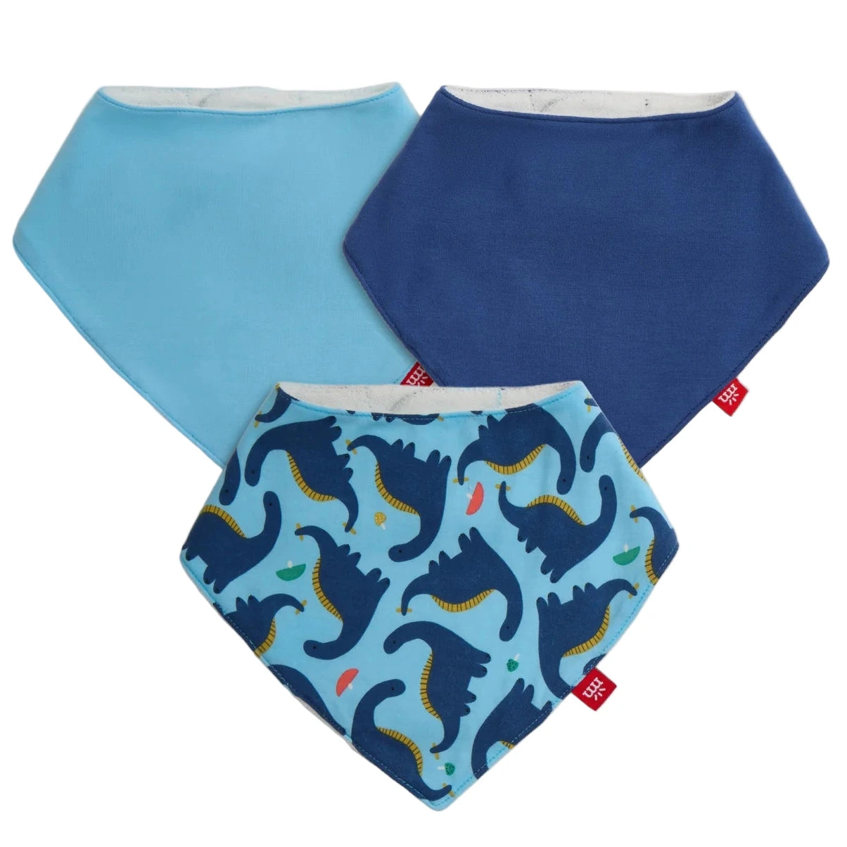 The Magnetic Me Necks Generation Modal Bandana Bib 3-Pack includes one solid light blue, one solid dark blue, and one dinosaur-patterned bib—all made from eco-friendly modal for gentle comfort.
