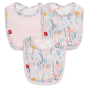 The Magnetic Me Shroom and Bloom Modal Bib 3-Pack includes three bibs: one solid pink and two with pastel floral and animal prints, all featuring rounded edges and a small red tag on the side.