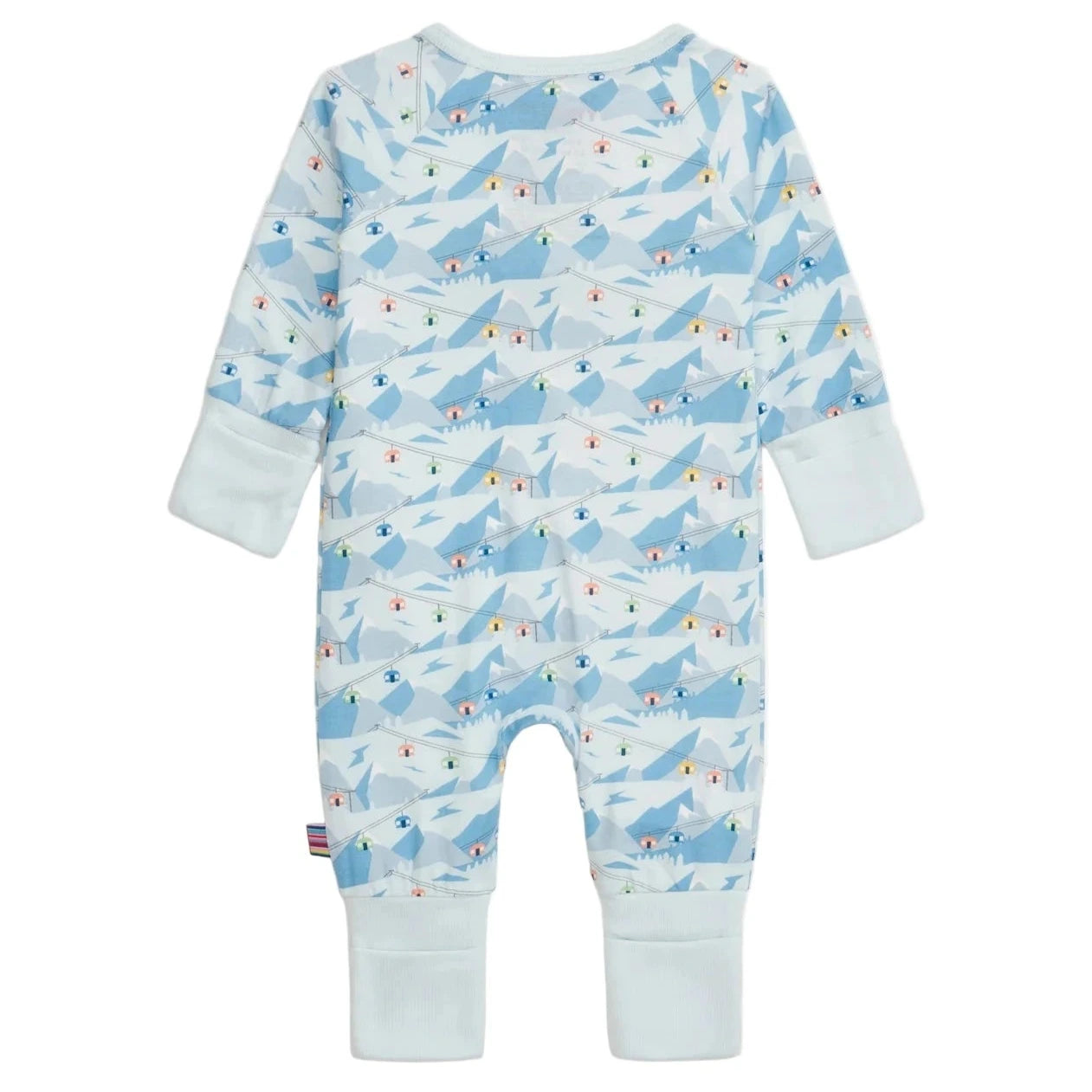 The Magnetic Me Baby Apres Chic Modal Convertible Coverall features a blue mountain and chalet print, long sleeves, white cuffs, and sustainable modal fabric for comfort. Its convertible design adapts as your baby grows.