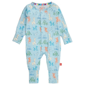The Magnetic Me Baby Party Animals Glow in the Dark Modal Convertible Coverall is a light blue onesie with a colorful animal print, rainbow trim on the collar, and snap buttons down the front.