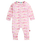 The Magnetic Me Baby Apres Chic Modal Convertible Coverall is a pink long-sleeve onesie with a mountain and cottage pattern, front snap closures, and rainbow-trimmed collar.