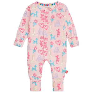 The Magnetic Me Baby Party Animals Glow in the Dark Modal Convertible Coverall features long sleeves, colorful animal and heart prints, a front zipper, rainbow collar lining, and is crafted from soft sustainable modal fabric for comfort.