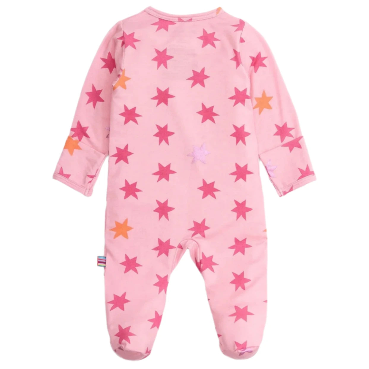 The Magnetic Me Baby Girls' Cosmic Confetti with Foil Modal Footie is a pink long-sleeve sleeper with pink and orange star patterns, covered feet, easy magnetic closures, and a rainbow side tag.