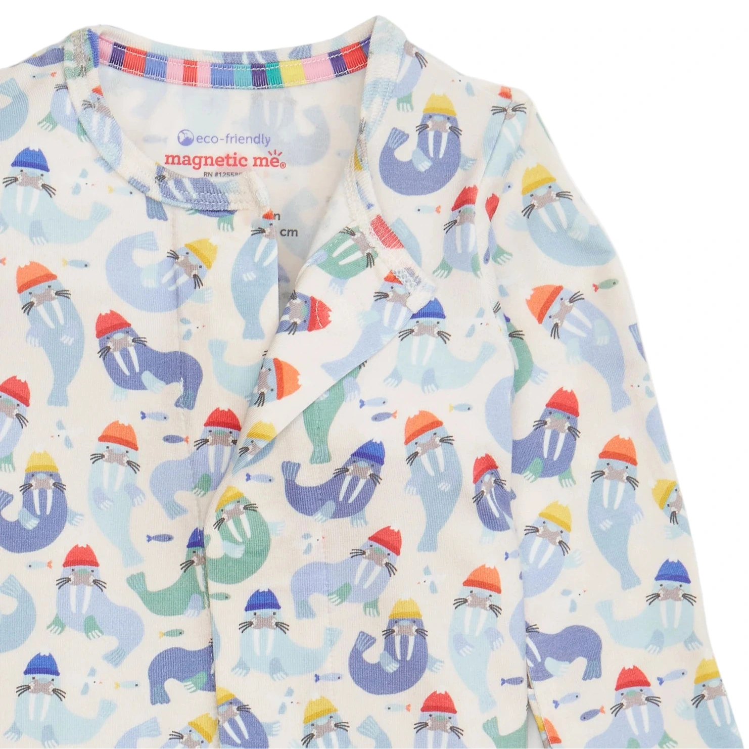 The Captain Wally Modal Footie by Magnetic Me features a playful walrus-in-hats pattern and a visible brand label, making it a cozy, easy-dress option that pairs perfectly with matching Magnetic Me separates.